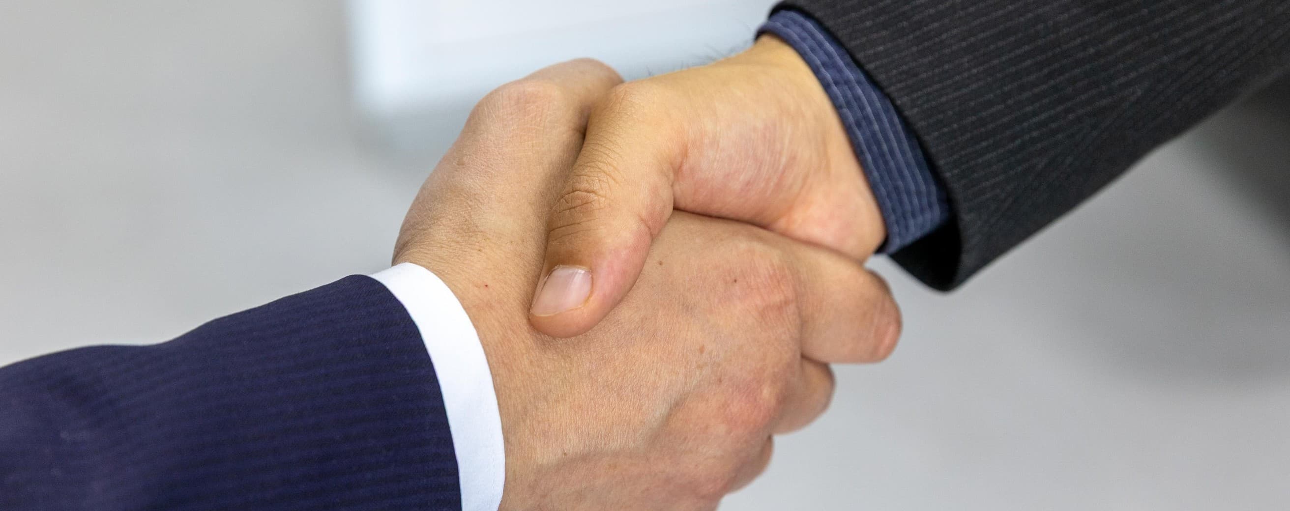 Two business partners shaking hands